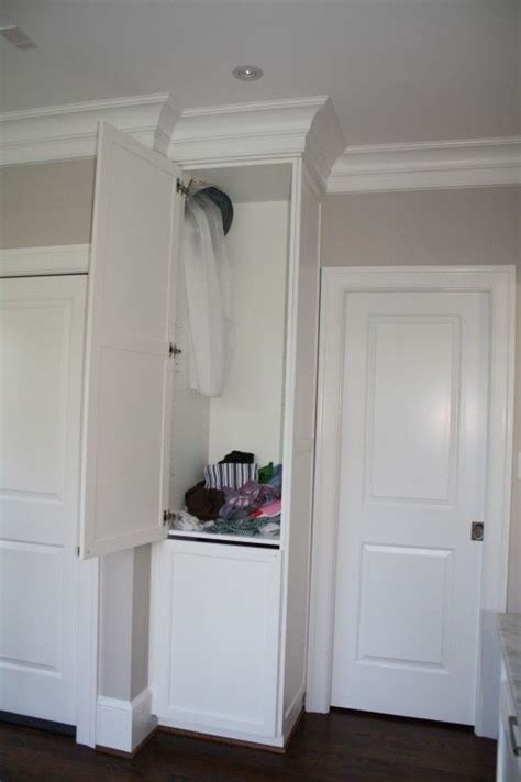 Modern beach craftsman kids bathroom laundry chute through floor. Must have laundry chute! I love the idea of it all landing ...