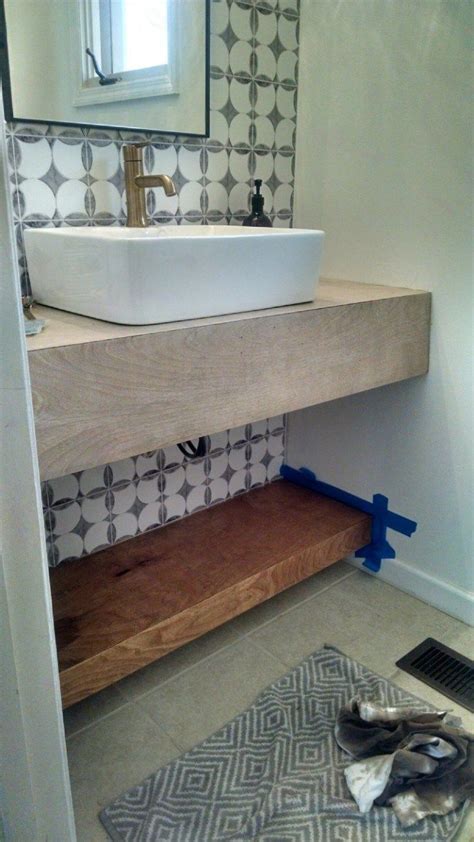Vanity floating shelves of reclaimed wood and a mirror frame of the same material. Floating Vanity DIY - Modern Bathroom Decor | Diy bathroom ...