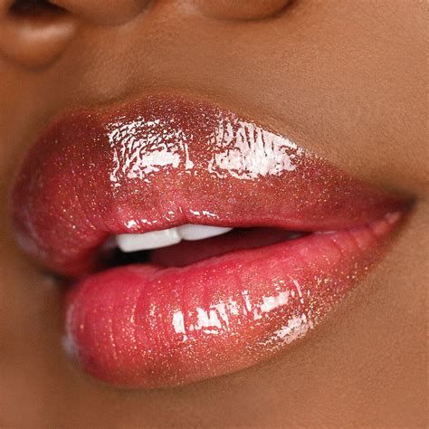 Dazzle With This Lavish High Shine Lip Gloss Featuring A Lightweight