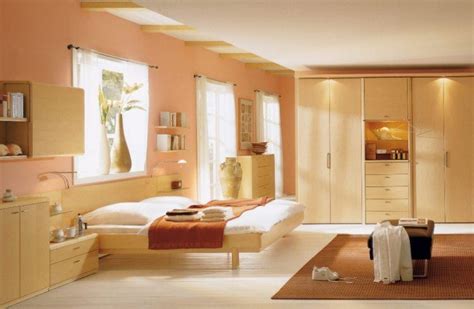 Pink bedroom with a small metal bed complementing the metal shelves racks and desks. 10 Beautiful Master Bedrooms with Pink Walls