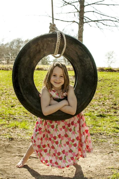Child In Tire Swing Stock Photo Image Of Tire Dress 39824644