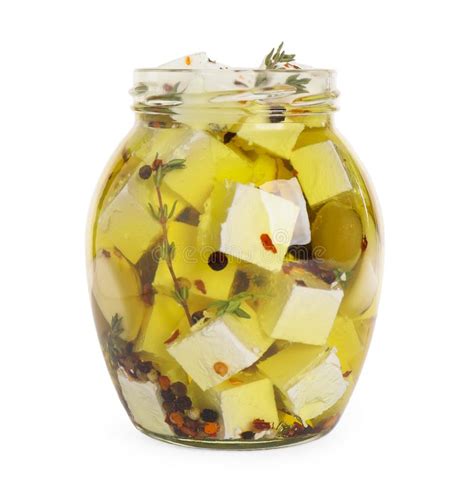 Open Jar With Feta Cheese Marinated In Oil On White Background Stock