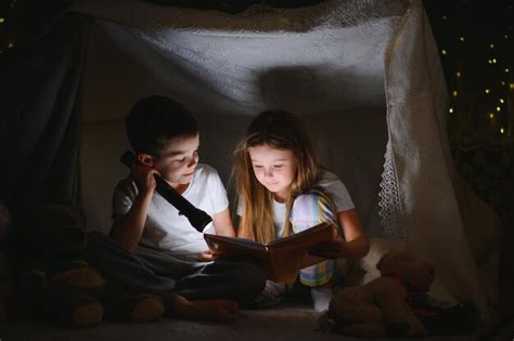 Premium Photo Little Children Reading Bedtime Story At Home