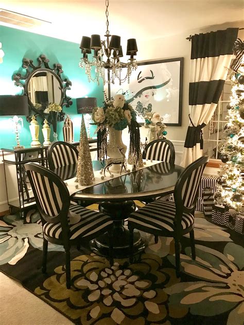 The neutral color combo allows for total freedom when it comes to design and construction. Christmas dining room . Teal, black , white , stripe , black ding table. Black and white stripe ...