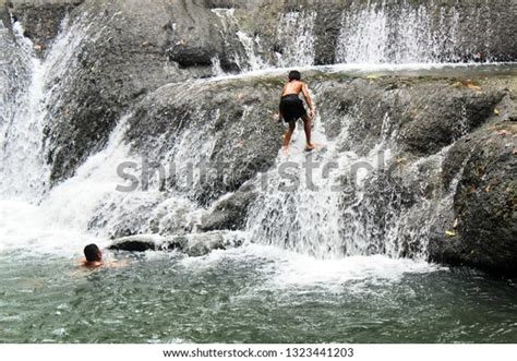 Children Playing Waterfalls On Summer Holidays Stock Photo 1323441203