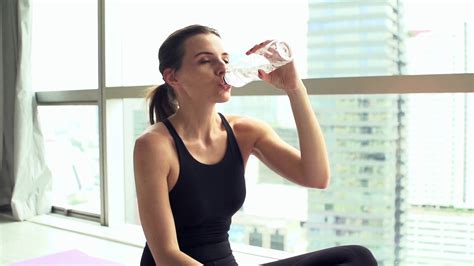 Young Woman Drinking Water After Workout Super Slow Motion Stock Video