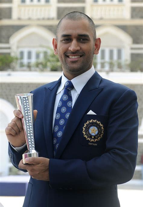 Ms Dhoni With The World Cup Trophy And His Man Of The Match Award From