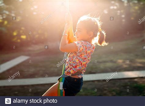 Children Jumping In Air In Park High Resolution Stock Photography And