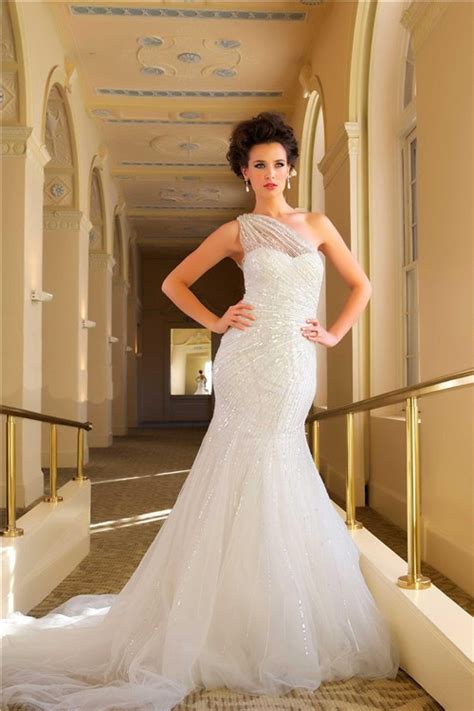 This dress uniquely flares outwards from the knee to create a modern and dramatic line. Unusual Mermaid One Shoulder Sparkle Sequins Wedding Dress ...