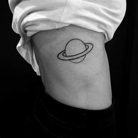 Outline Saturn Tattoo Inked On The Right Rib Cage Saturn Tattoo