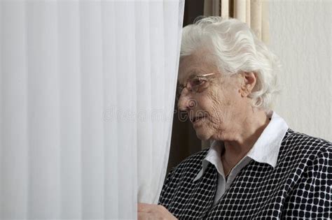 Lonely Old Woman Looking Out Of Window Stock Images Image 13718014