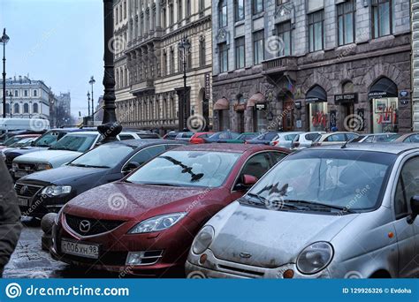 Cars Parked On The Street In The City Center And Pedestrians Editorial