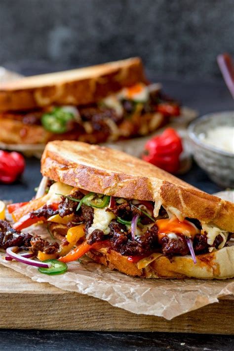 Steak sandwiches are sometimes served with toppings of cheese, onions, mushrooms, peppers, tomatoes. This Korean Steak Sandwich with Jalapenos and Garlic Mayo ...