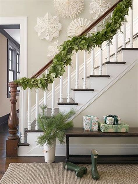 Decorating your banister for christmas creates a. Step Into The Christmas Spirit With A Garland-Draped ...