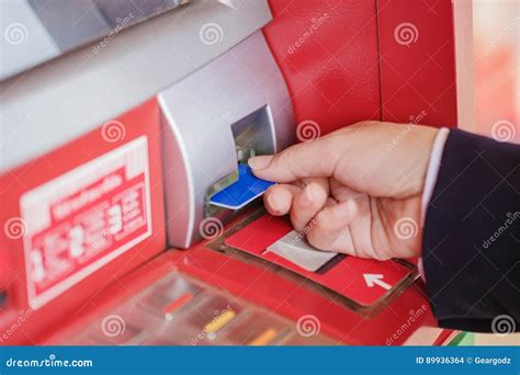 Hand Puts Credit Card Into Atm Stock Photo Image Of Electronic
