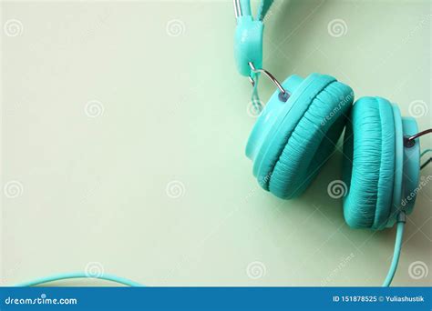 Headphones Turquoise On A Light Green Background Copy Space Stock