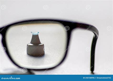 Blue Contact Lens Through Black Eyeglasses Shows Different Eyewear To