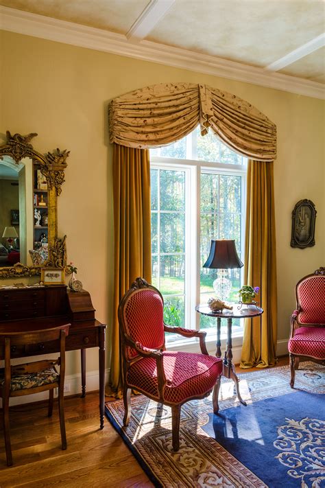 Help your windows stand out with curtains and window treatments. This room opens up with this grand window in this Tuscan ...