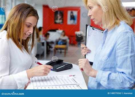 Receptionist and Manager at Beauty Salon Reception Stock Photo - Image