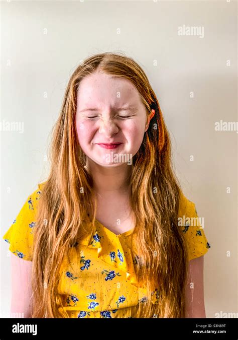 Young 11 Year Old Girl Laughing And Pulling Face Stock Photo Alamy
