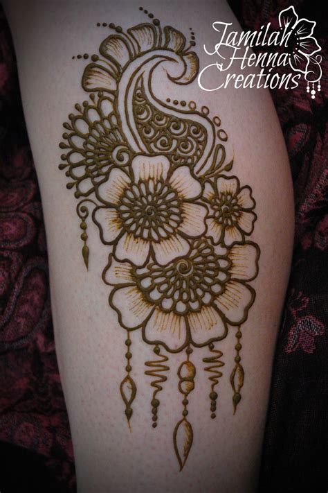 Small circular embellishements are pictured in the center of the piece as well as between the. flower paisley leg henna www.jamilahhennacreations.com ...