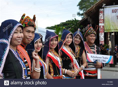 Traditional materials were leather, fur and thin felt. Kadazan dusun tribe in traditional costume during Sabah ...