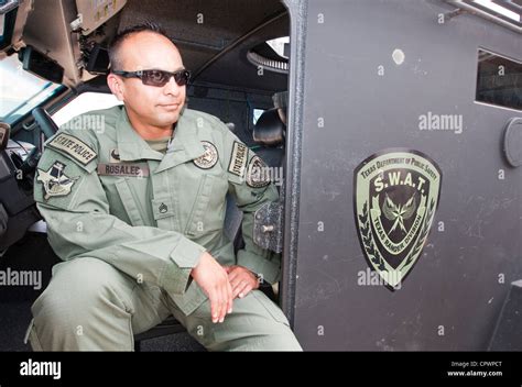 Male Member Of The Texas Department Of Public Safety Swat Team Division Texas Rangers Sits In