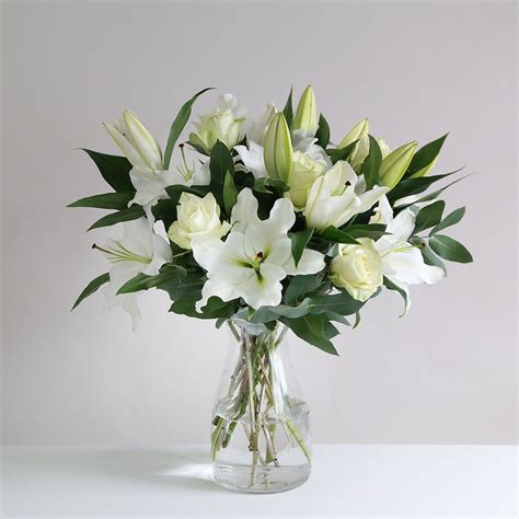 Oriental Lily And Rose This Elegant Pure White Bouquet Is Perfect In
