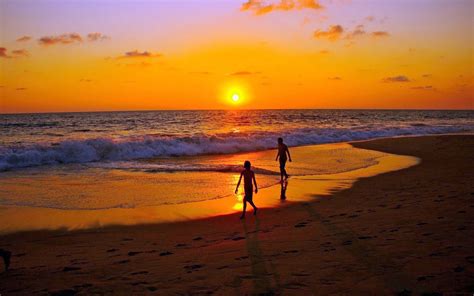 Walking On Beach At Sunset Silhouettes Sea Hd Wallpaper
