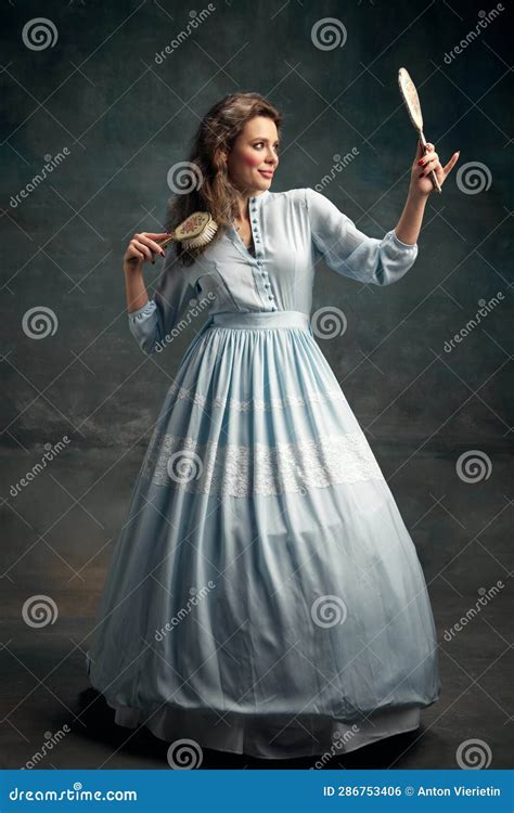 Full Lenght Portrait Of Charming Aristocratic Woman Wearing Blue