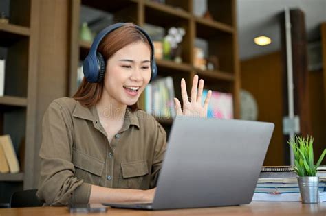 Asian Female Freelance Online Tutor Teaching Her Students Via Laptop
