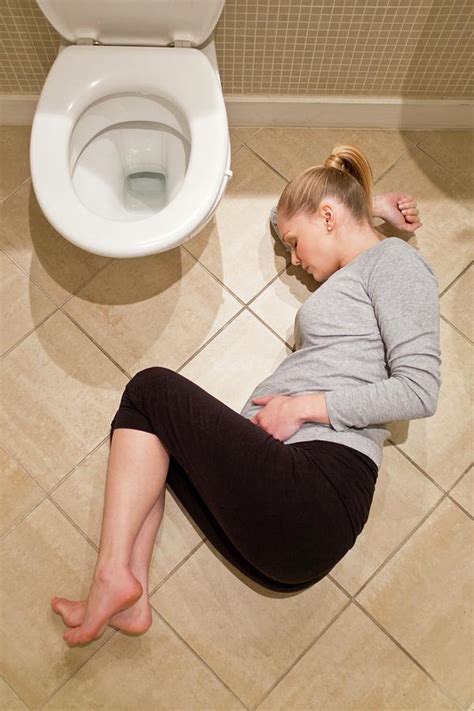 Pregnant Woman Lying On Bathroom Floor Photograph By Ian Hootonscience