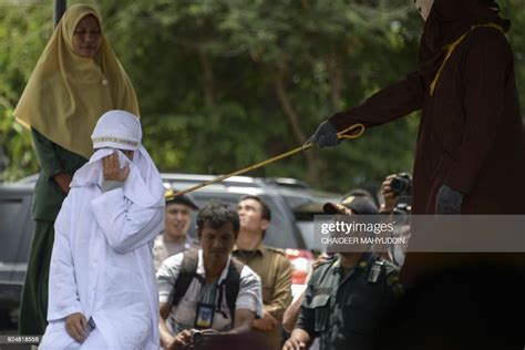 Tjia Nyuk Hwa An Indonesian Christian Is Publicly Flogged Outside A