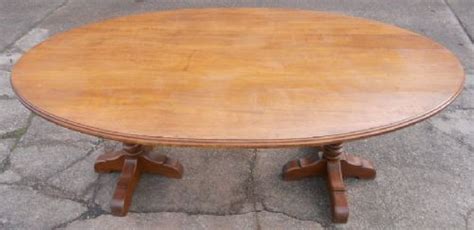 An oval pedestal style dining table. Large Oval Oak Pedestal Dining Table To Seat Eight ...