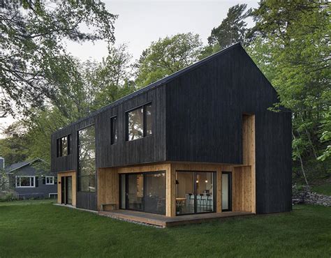 Black Charred Wood Siding Creates A Bold Look For This Lakeside Home