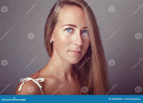 Calm Pensive Caucasian Blonde Young Beautiful Girl Woman Model With Long Hair And Blue Eyes In