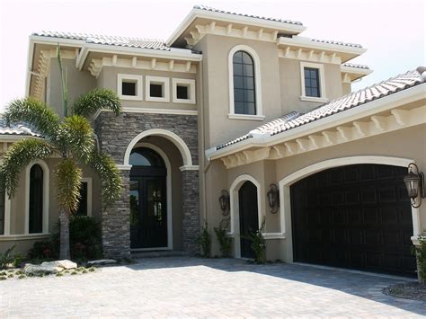 Our home is the coastal home painted amherst gray with the. Love the stone work | Exterior paint colors for house ...