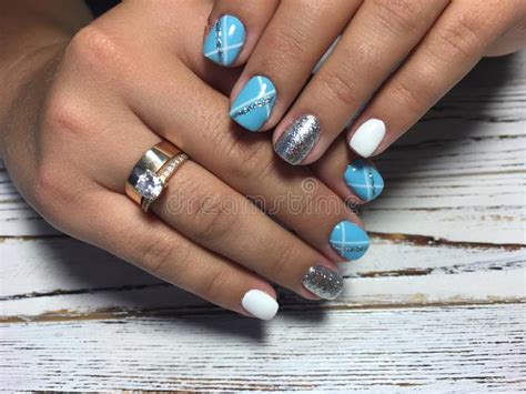 Fashionable Blue Manicure With A Shiny Design Stock Photo Image Of