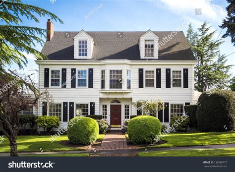 Classic American Suburban House With Blue Sky Background Stock Photo
