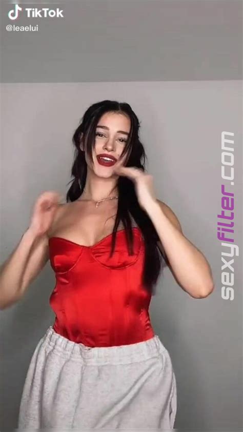 Sexy Lea Elui Ginet Shows Cleavage In Red Top