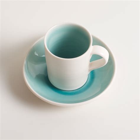 Slip casting • porcelain • gold. Handmade espresso cup & saucer - Linda Bloomfield