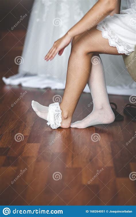 Young Woman Wearing White Stockings Laying On Her Slim Legs Stock Image