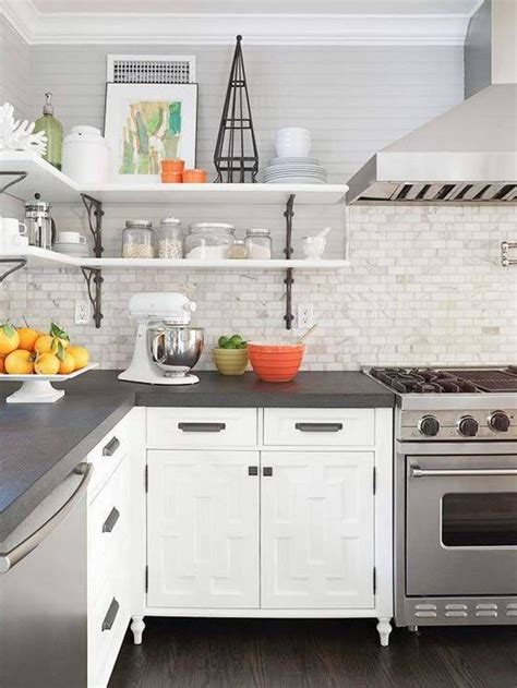 · gray flat panel cabinets are used on gray backsplash tiles and a white granite counter to create a color combination that is easy on the eyes. Grey countertops (edge cut), white cabinets, marble ...