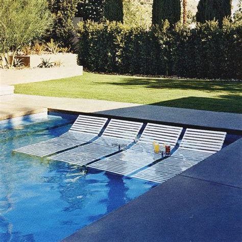 You can have chitchats, have a drink or munch snacks while in the pool. Pool Chairs | Swimming pools backyard, Pool landscaping ...