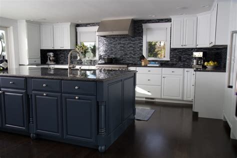 Glass fronts on the upper cabinets and window panes in the pantry door assist this purpose and allow pops of accent colors to show from the inside. By Kitchen & Bath Gallery Cape Cod Kitchens Boston Black ...