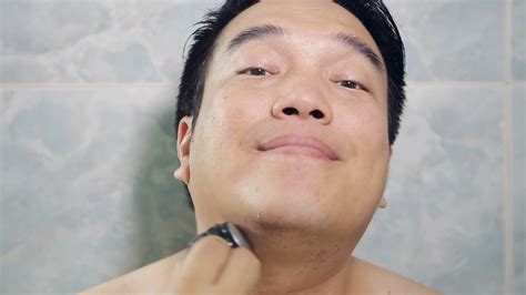Happy Asian Man Shaving Beard High Definition Video Stock Video Footage