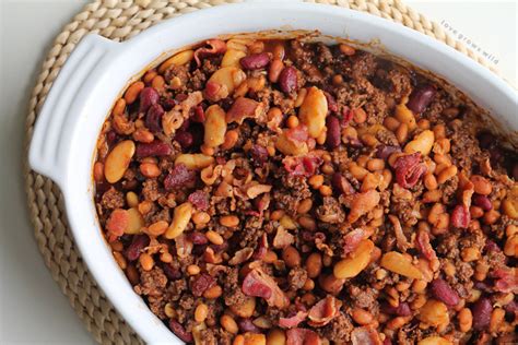 Simple spicy cowboy baked beans will make even those that don't like baked beans fall in love. Beef and Bacon Baked Beans - Love Grows Wild