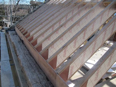 One end of the ceiling joists sits on an exterior wall top plate and we have to cut the joist ends to match the angle of the hip roof slope. Golcar Passivhaus: Roof strategy - Green Building Store ...