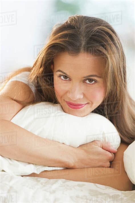 Woman Lying On Bed Stock Photo Dissolve