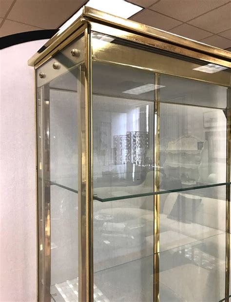 Mastercraft Brass And Glass Curio Cabinets Display Cases Vitrines Pair At 1stdibs Brass And